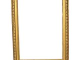 a gold picture frame on a white background with a white background