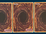 three cards with a picture of a spiral design on them