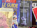 many books that are on a red table