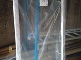 a blue broom that is sitting in a plastic box