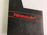 the nintendo logo is shown on the back of a black card