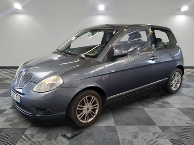 a picture of a small car parked in a garage