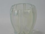 a glass vase that is sitting on a table