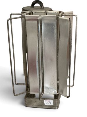 a metal container that has a handle on it
