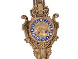 a clock that is hanging on the side of a wall
