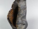 a close up of a piece of metal with a hole in it