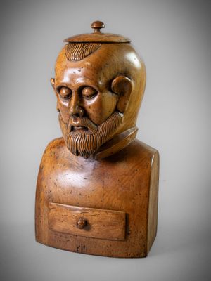 a wooden bust of a man with a beard and mustache