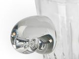 a clear glass vase with a silver handle on a white background