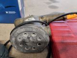 a picture of a red tool box and some tools on the floor