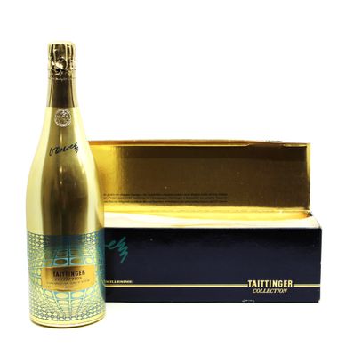a close up of a bottle of champagne next to a box