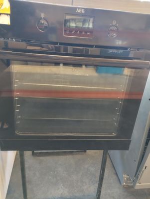 a black oven that is sitting in the kitchen