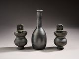 three vases sitting next to each other on a table