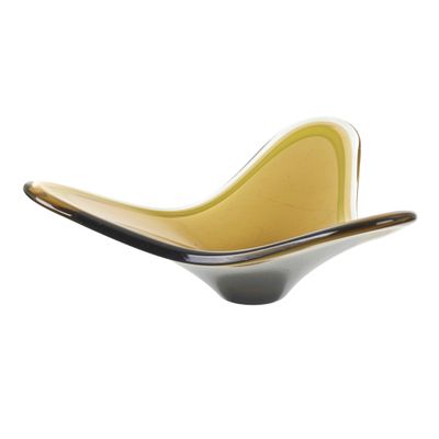 a close up of a yellow and black bowl on a white background