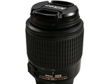 a black camera lens sitting on top of a cup
