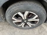a close up of a tire on a car ' s rim
