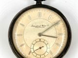 an old pocket watch with roman numerals on the face