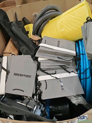 a cardboard box full of electronics and other items