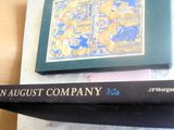 two books sitting on top of a table next to each other
