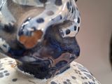 a blue and white vase with a bird on it