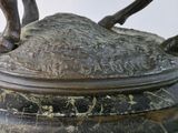 a statue of a horse that is on a table