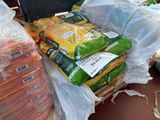 many bags of food sitting on a pallet