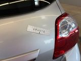 a sticker on the back of a silver car