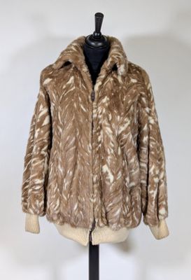 a close up of a fur coat on a mannequin stand