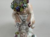 a figurine of a woman with a wreath on her head