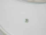 a close up of a white plate with chinese writing on it