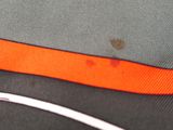 a close up of a pair of scissors on a piece of cloth