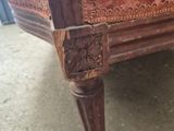 a chair that has a wooden frame on it
