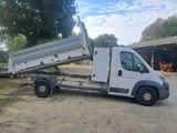 a white truck that is parked in the dirt