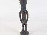 wooden figure of a man with a hat on his head