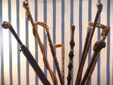 many different types of walking canes in a vase