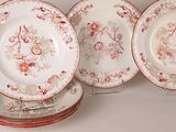 four plates with different designs on them on a table