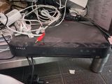 an image of a television set on a table with wires