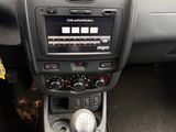 a car dashboard with a control panel and a steering wheel
