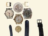 a lot of watches that are sitting together on a table