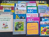 many children ' s books on the table together
