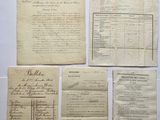 a bunch of old papers sitting on top of a table