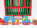 a toy train that is sitting in front of a box