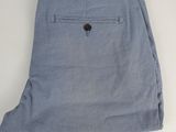 a close up of a pair of blue pants on a white surface