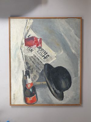 a painting on the wall of a room with a hat on it