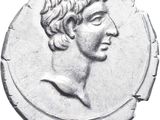an ancient roman coin with a man ' s face on it