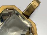 an image of a close up of a pendant with a faceted facet