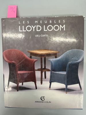 two chairs sitting next to a table in a book