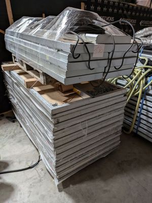 many stacks of metal sheets stacked on top of each other