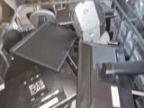 a pile of electronic equipment in a plastic container