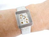 a woman ' s wrist that has a watch on it