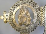 a gold plate with a picture of a woman inside of it